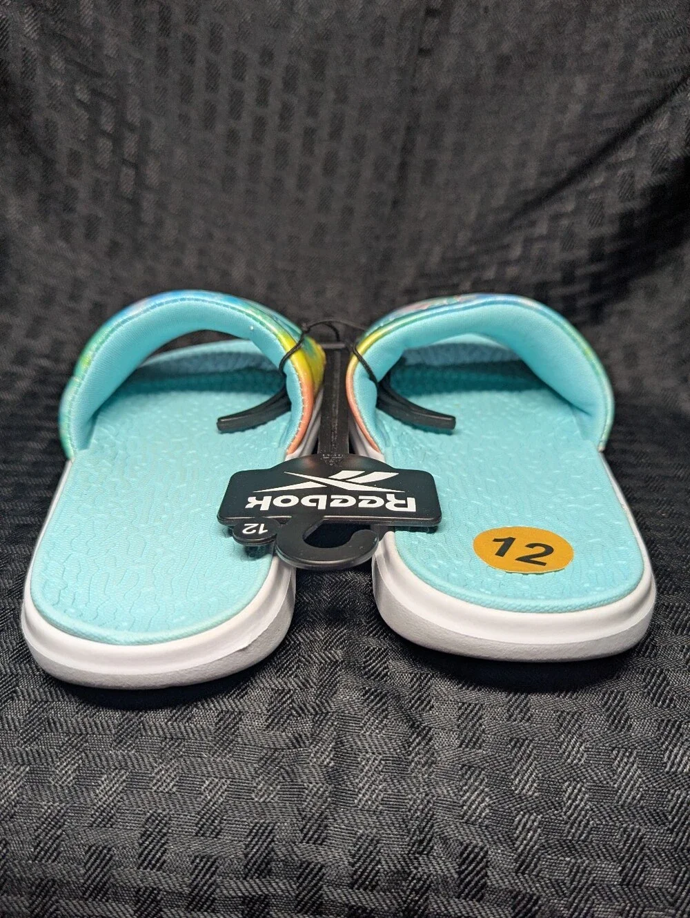 Aqua & Tie-Dye Reebok Slide Sandals.
